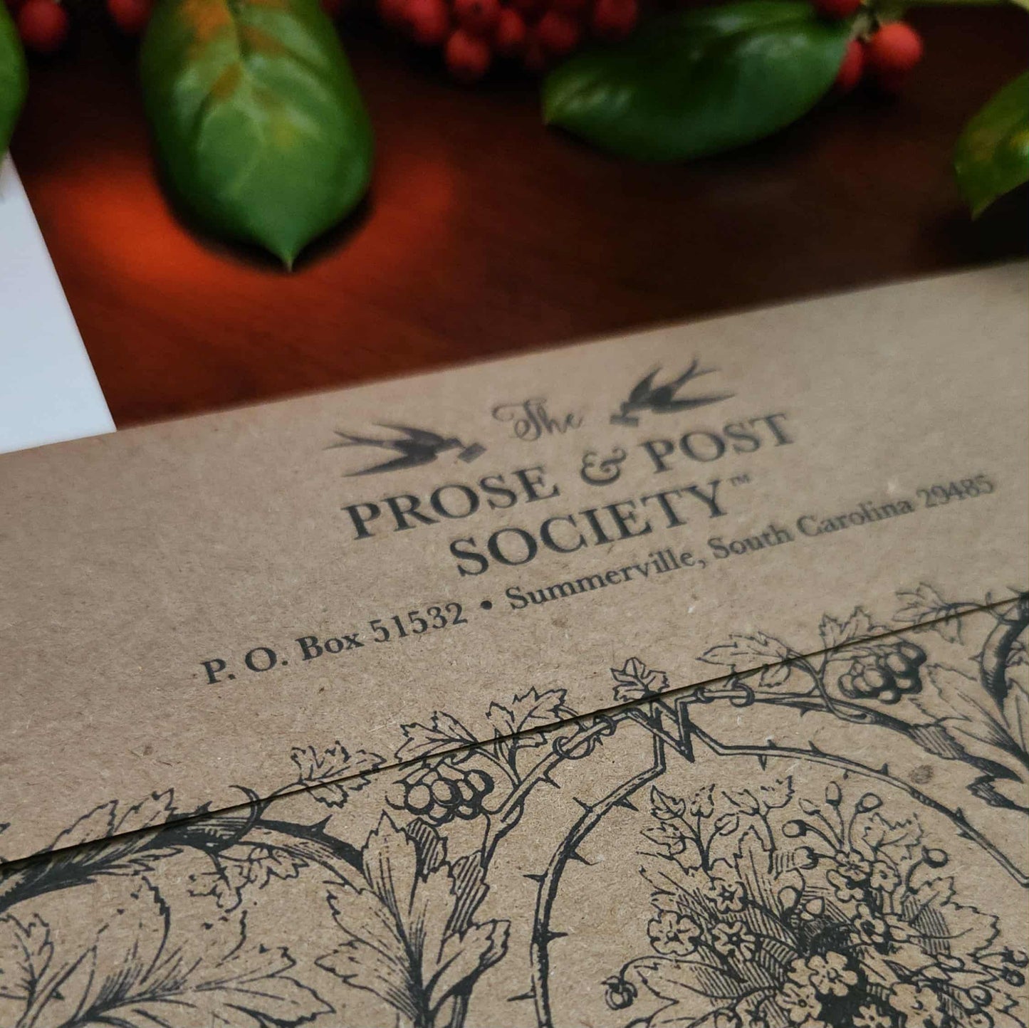 Envelope with 'The Prose & Post Society' branding and decorative elements.