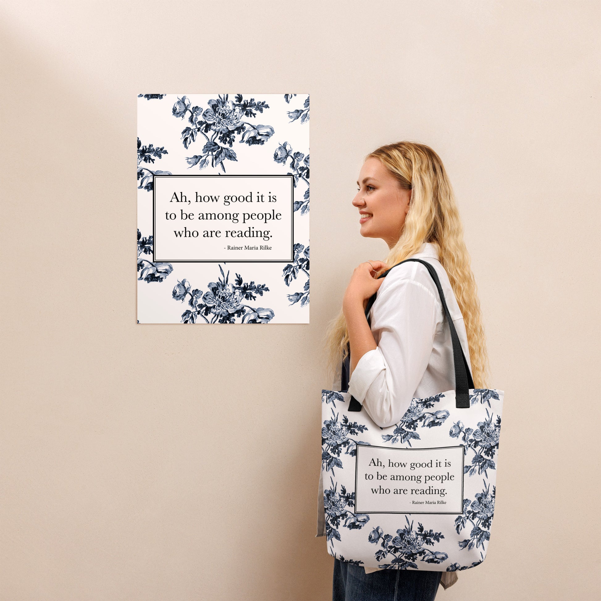 Woman holding white tote bag with Rilke quote ‘Ah how good it is to be among people who are reading’ and toile print on the bottom