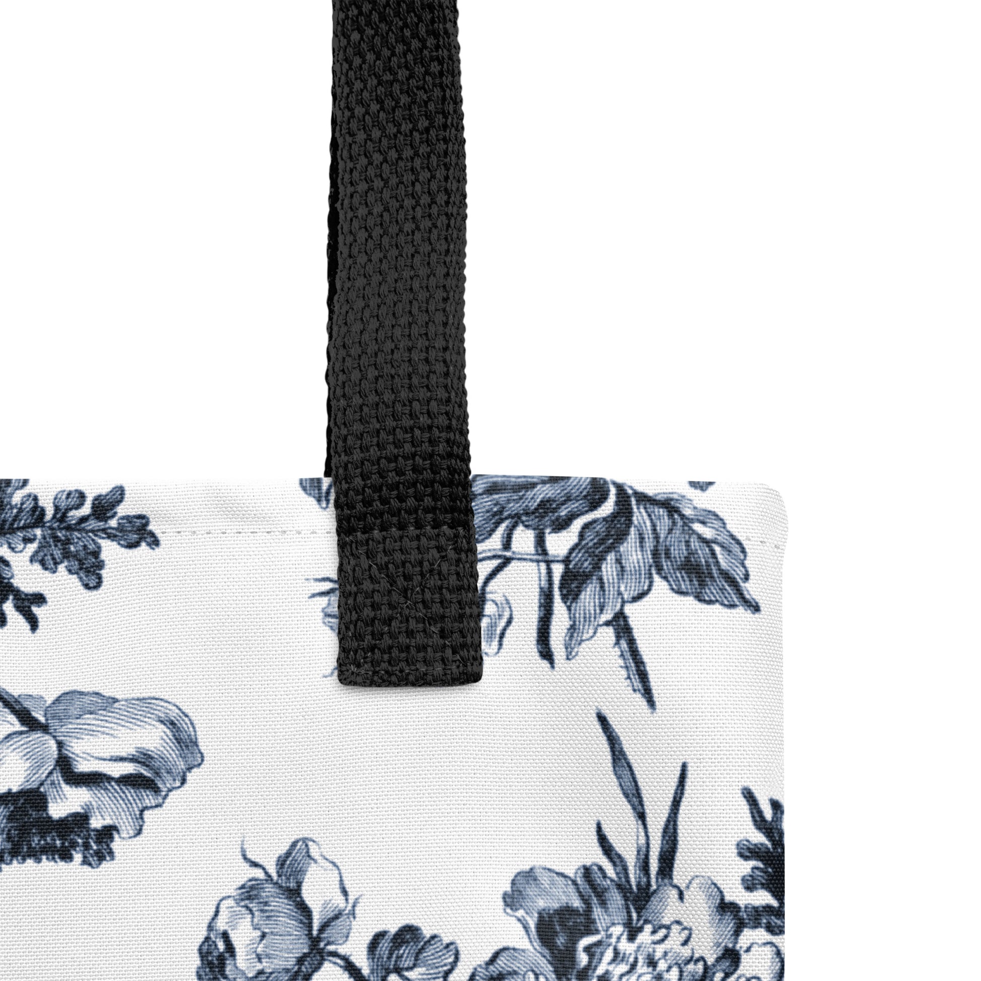 Detail of handle for white tote bag with Rilke quote ‘Ah how good it is to be among people who are reading’ and toile print on the bottom