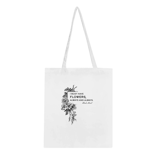 White tote bag with Claude Monet quote ‘I must have flowers, always and always’ and vintage floral illustration