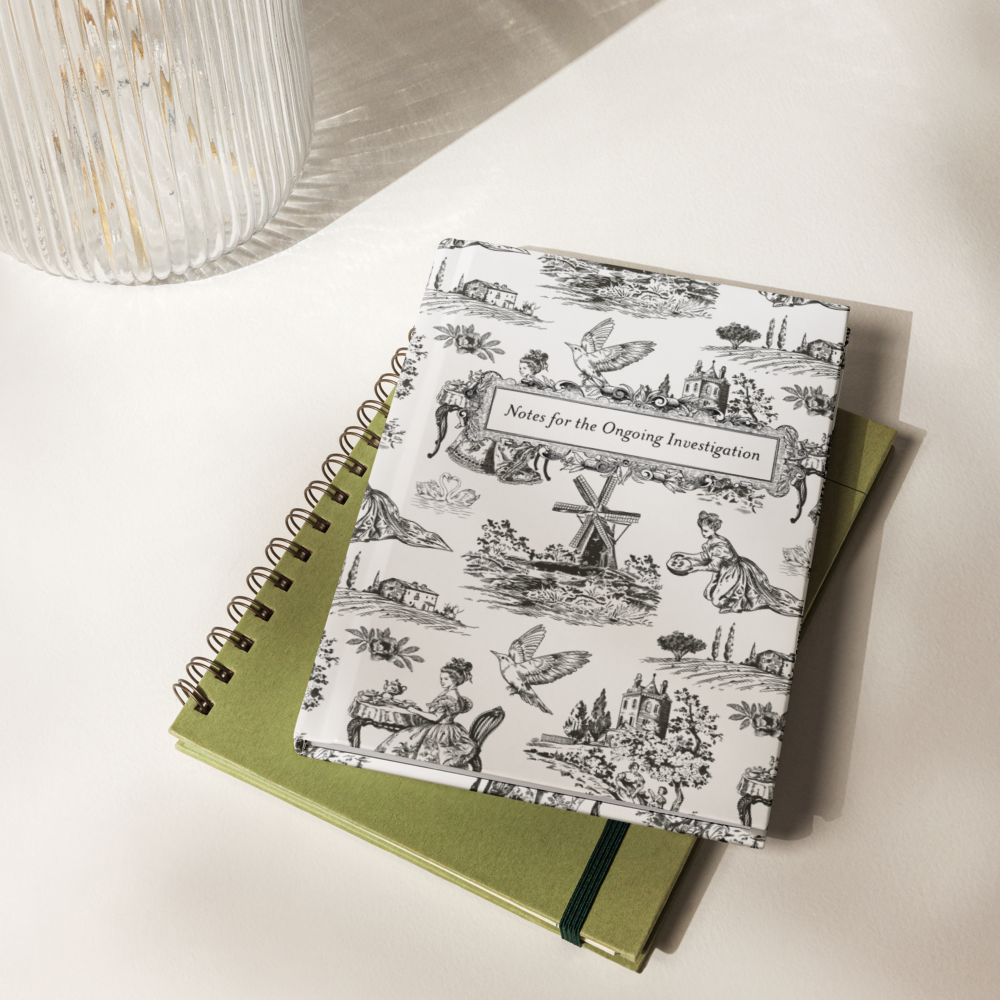 NHardcover journal with black-and-white French toile pattern and framed title “Notes for the Ongoing Investigation”