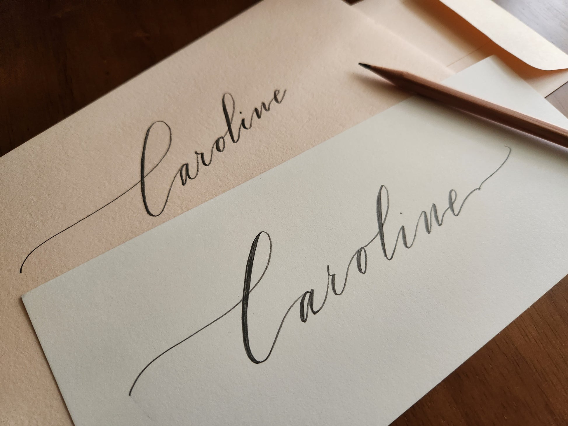 Six-Penny Stamp - Calligraphy of the name 'Caroline' on a piece of paper with an envelope.