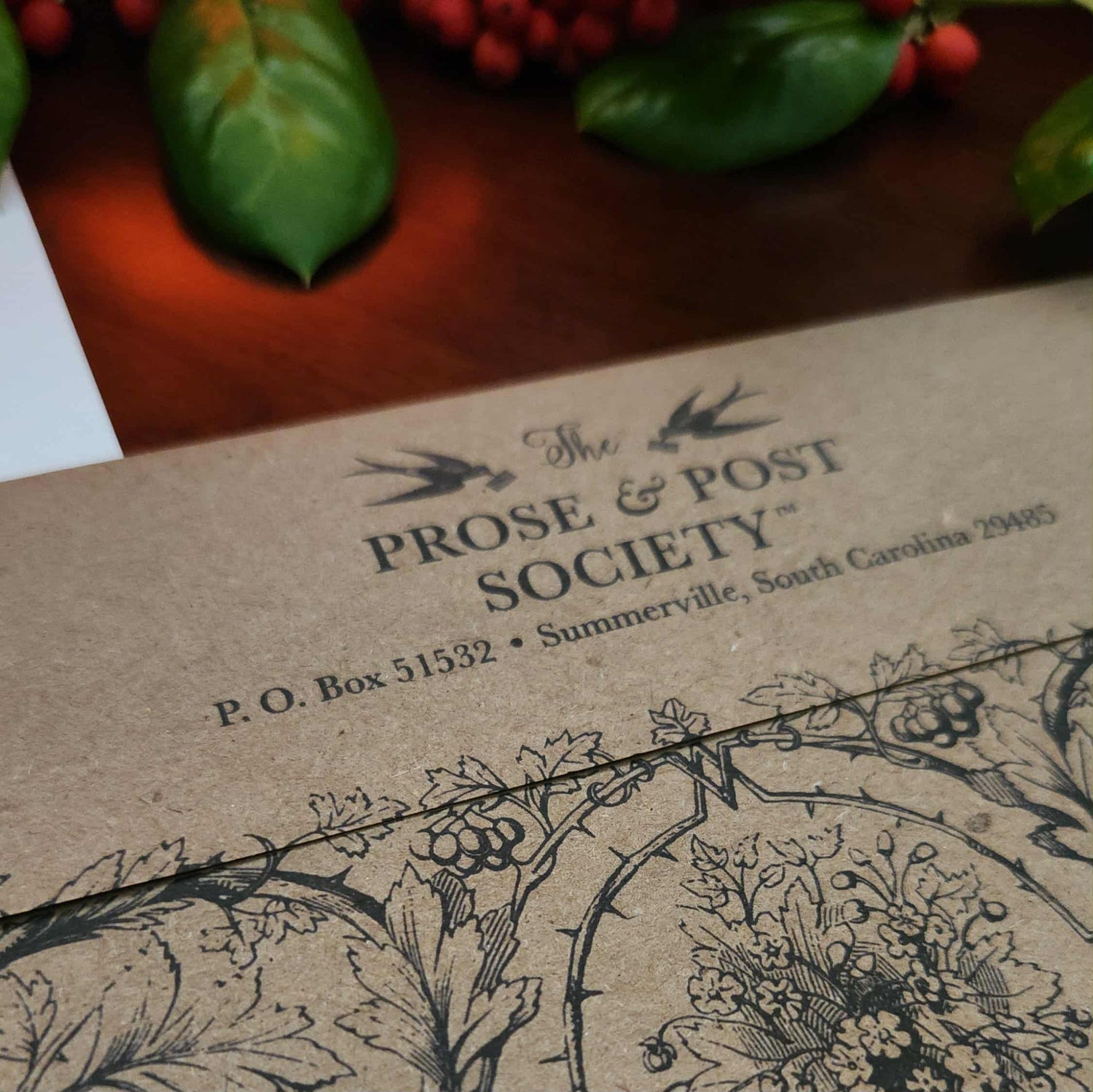 Envelope with 'The Prose & Post Society' branding and decorative elements.