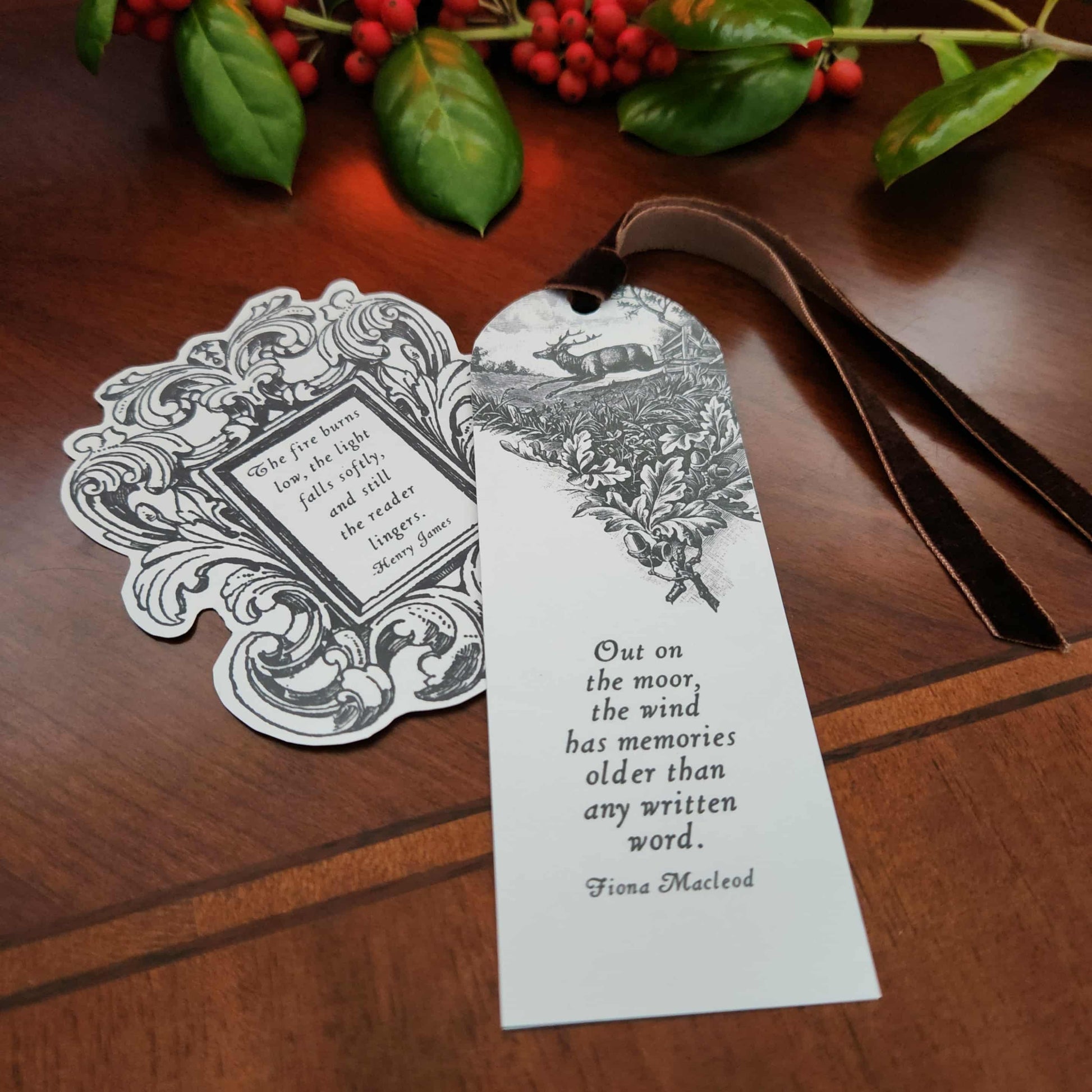 Decorative sticker and bookmark with literary quotes on a wooden surface. From The Prose & Post Society. 