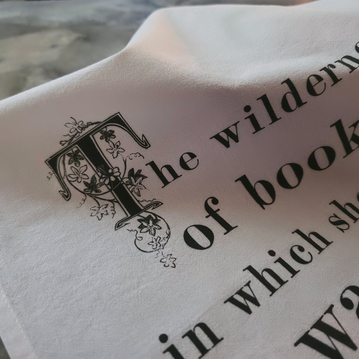The Wilderness of Books Tea Towel